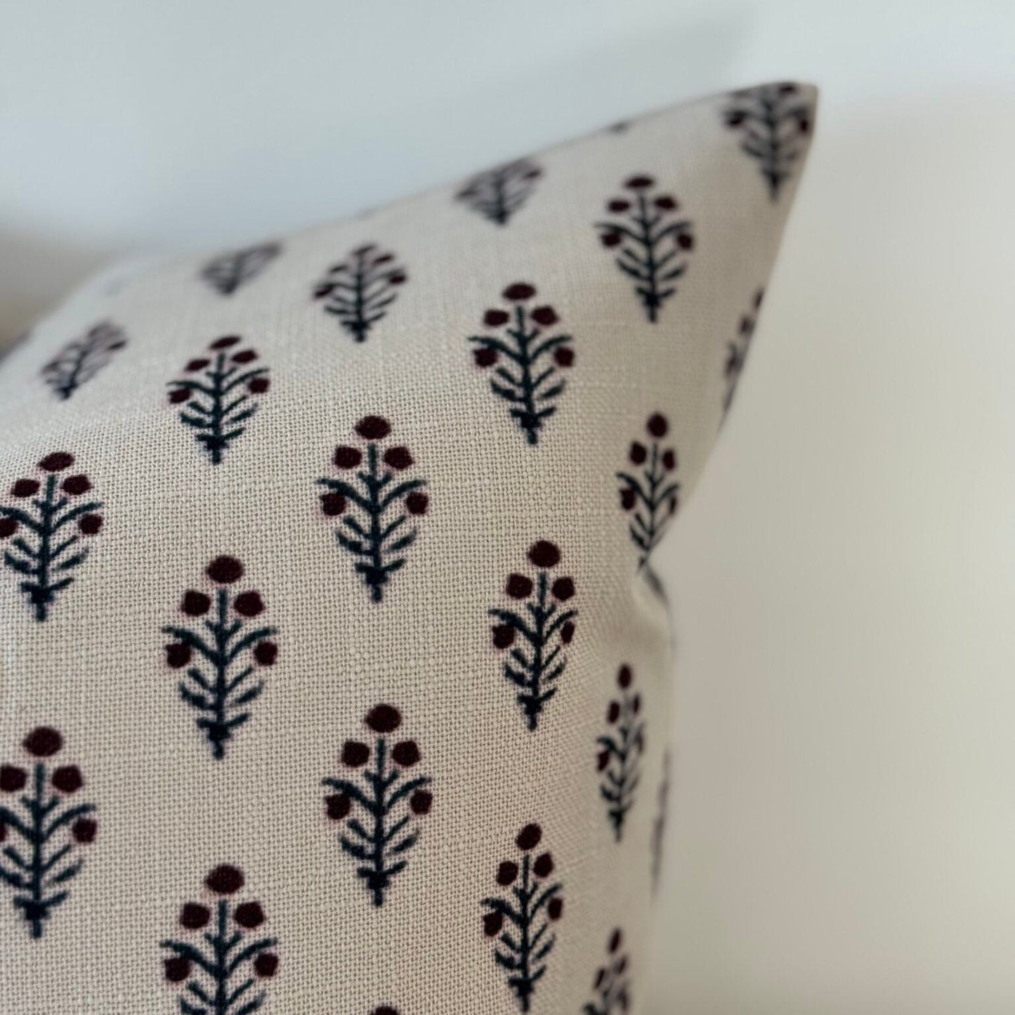 Cushion with floral pattern on a white background