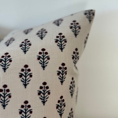 Cushion with floral pattern on a white background