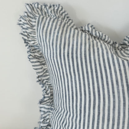 Striped fabric with ruffled edges on a plain background